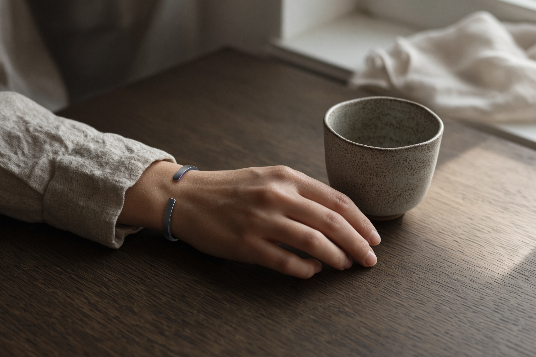 Cuff on a wrist at a table
